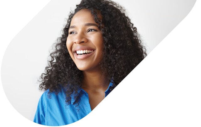 A smiling woman with curly hair looking off to the side framed in a colored oval